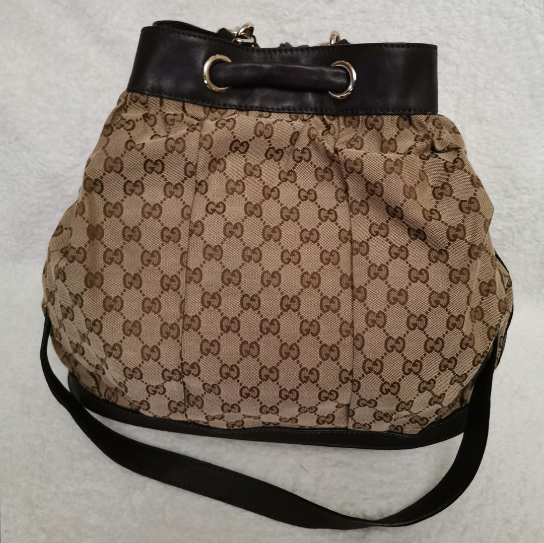 GUCCI Drawstring Bucket Bag (Category: Luxury Bags & Wallets) located in Pasig City. Submitted by chichirepublic (Listing ID 1035354743, Image 3). Description: Preloved Gucci drawstring bucket bag in good Condition. Minor signs of usage only. Issue: very small tastas at the bottom which is easily repairable. With Code but authenticity not guaranteed as this is ukay source..