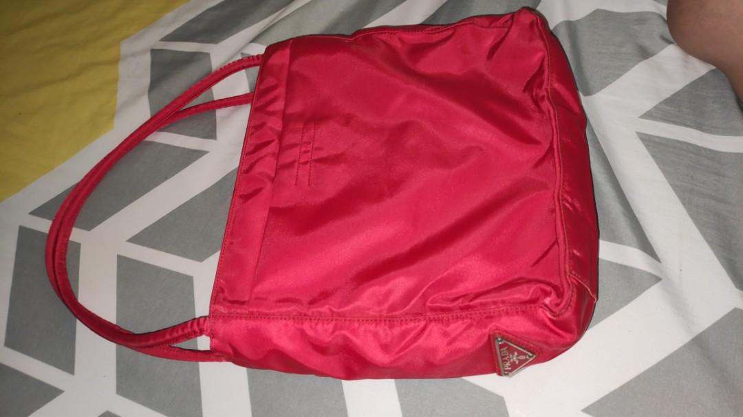 Prada Milano Tote Shoulder Bag 100% authentic (Category: Luxury Bags & Wallets) located in Santa Maria. Submitted by casa_de_marques (Listing ID 1035219523, Image 1). Description: red Prada Milano mini Shoulder bag check pics for authenticity with dust bag negotiable.