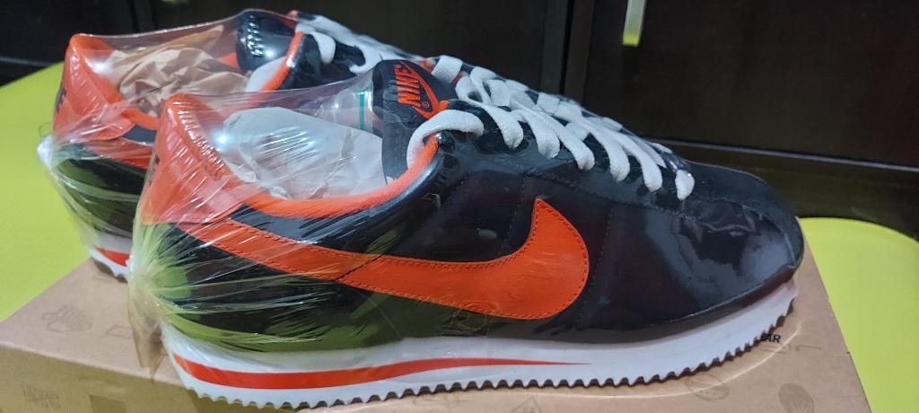 nike cortez black orange