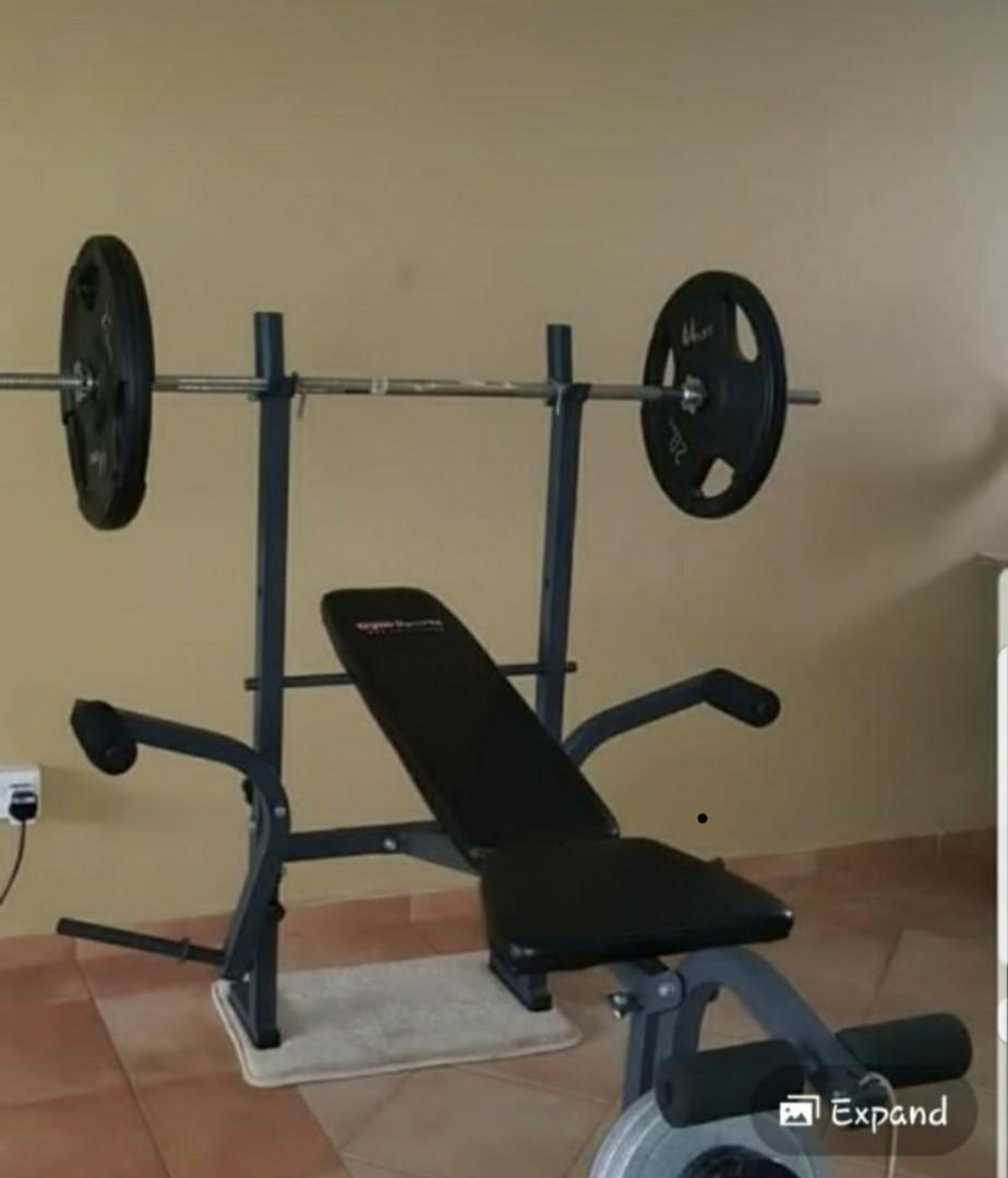 Universal bench press with barbell set. Sports Equipment