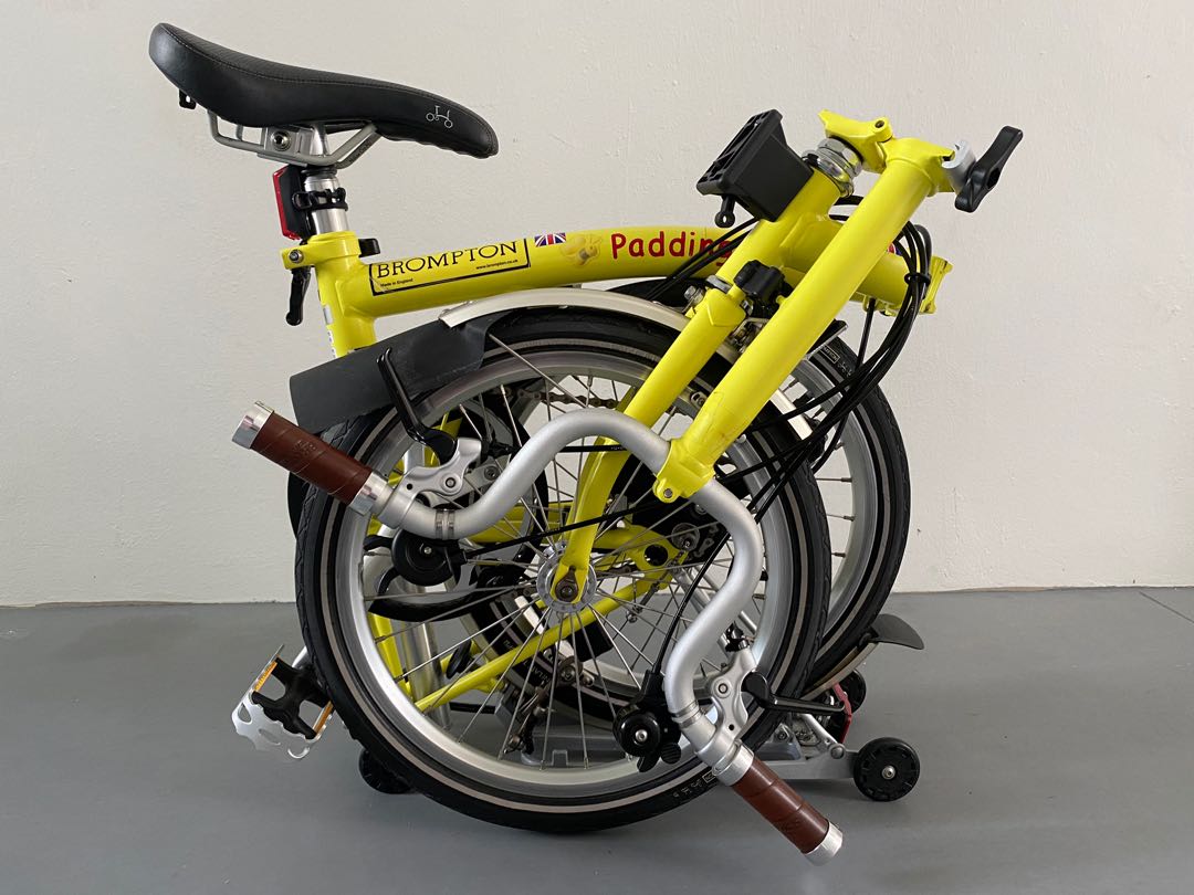 yellow brompton bike