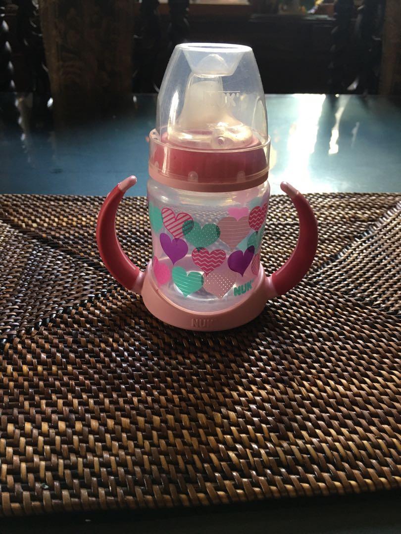 Pink Hearts Sippy (Category: Soothers & Pacifiers) located in Quezon City. Submitted by gelaidiaz (Listing ID 1032671690, Image 1). Description: Brand: Nuk Issue: None but teats should be replaced for hygiene purposes Note: Will be shipped/ delivered as in. No box anymore. MOP: Gcash, Metrobank Transfer, COD thru GogoExpress .
