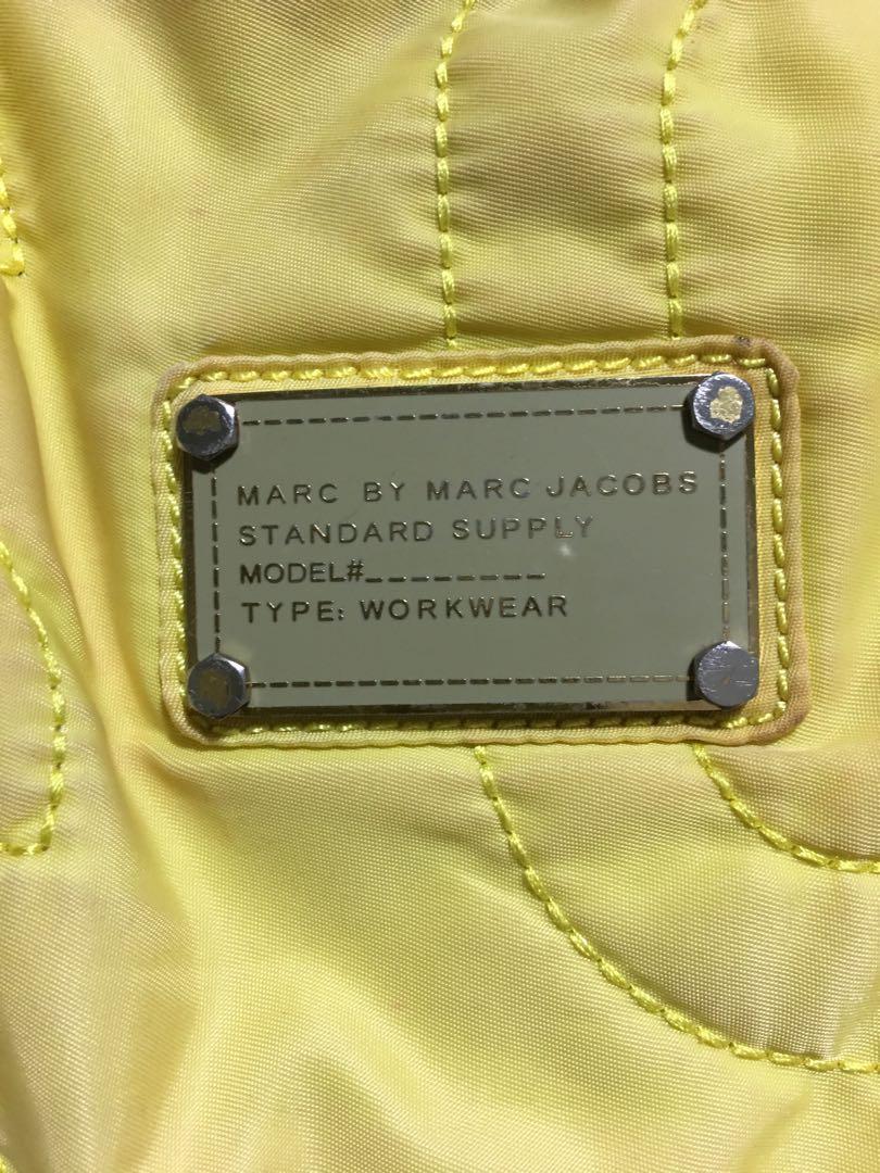 Marc Jacobs large nylon bag (Category: Luxury Bags & Wallets) located in Pasig City. Submitted by 53888 (Listing ID 1036586934, Image 2). Description: Selling low Authentic MJ nylon tote Measurement: L18” x H21” Flaw: fading color (visible on the photos).