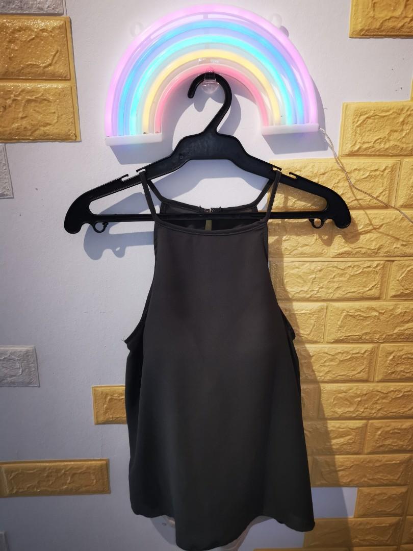 Moss green halter top (Category: Sleeveless) located in Valenzuela. Submitted by treenee (Listing ID 1036482585, Image 1). Description: closet purge! good quality halter top with hand-sewn nude padded camisole (see 3rd photo) May fit up to medium MOP: BPI BDO Paymaya.