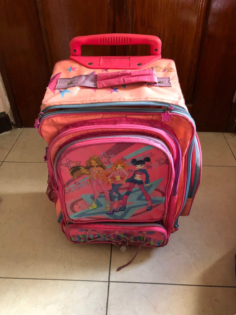 Winx club stroller school bag (Category: Strollers) located in Manila. Submitted by bondea (Listing ID 1036463689, Image 1). Description: Defective zipper Side pocket with hole.