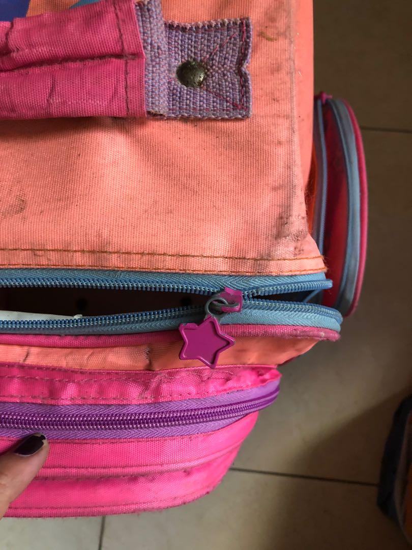 Winx club stroller school bag (Category: Strollers) located in Manila. Submitted by bondea (Listing ID 1036463689, Image 3). Description: Defective zipper Side pocket with hole.