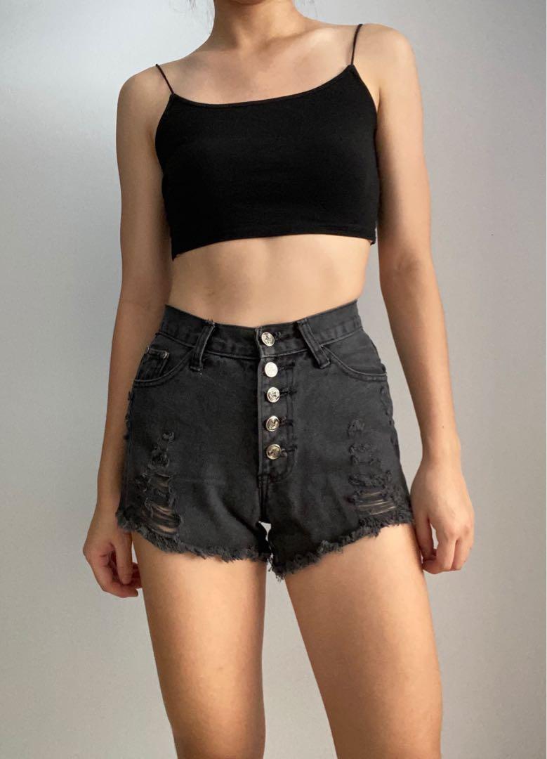 black ripped up shorts