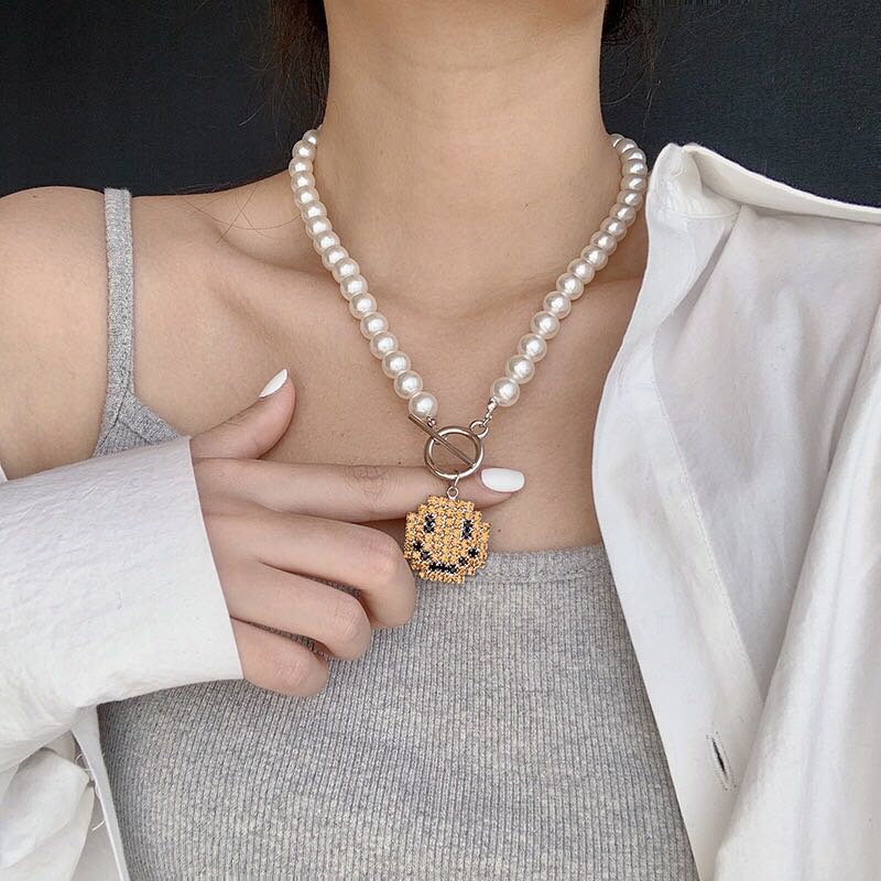 Pearl necklace sales with smiley face