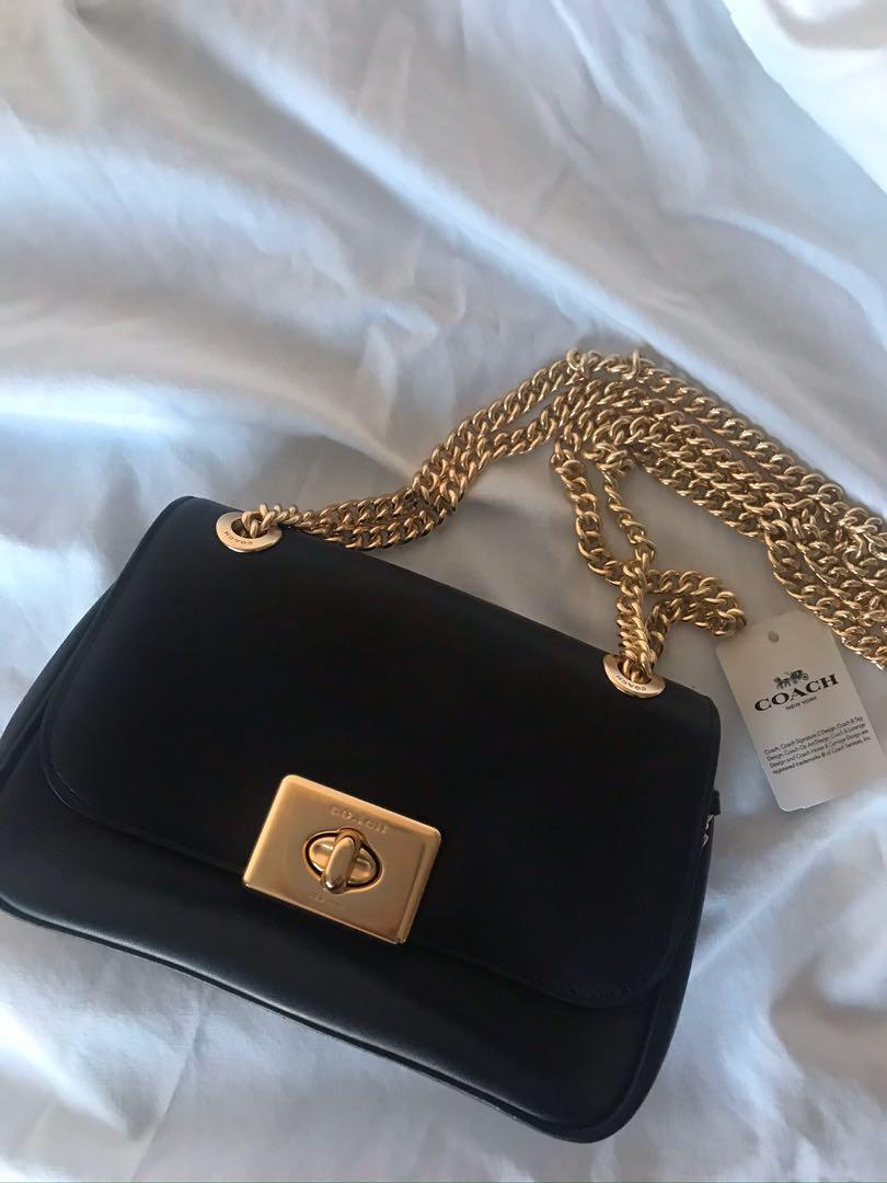 Black coach bag with gold 2025 chain