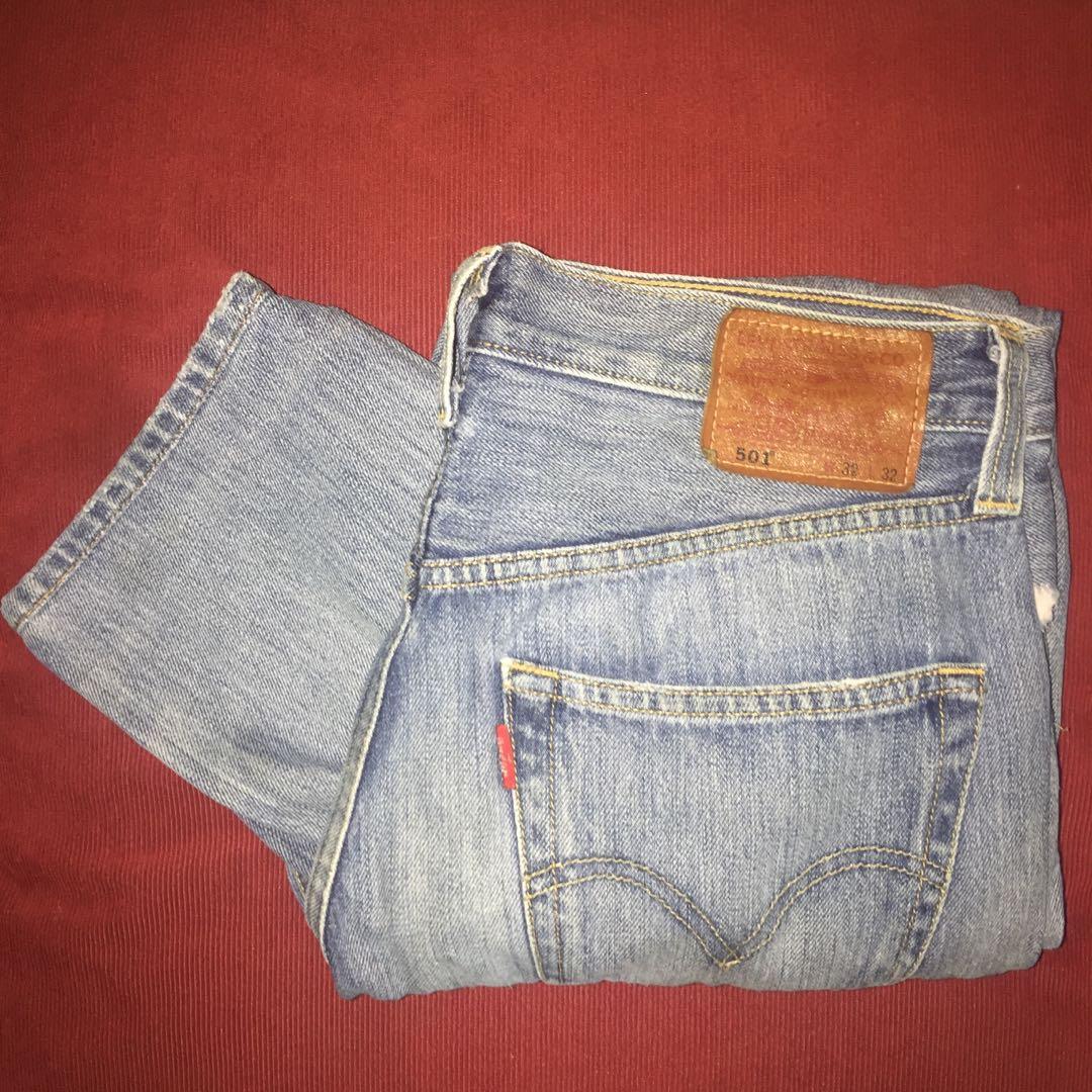 Levi's 501 Ripped Jeans, Men's Fashion, Bottoms, Jeans on Carousell