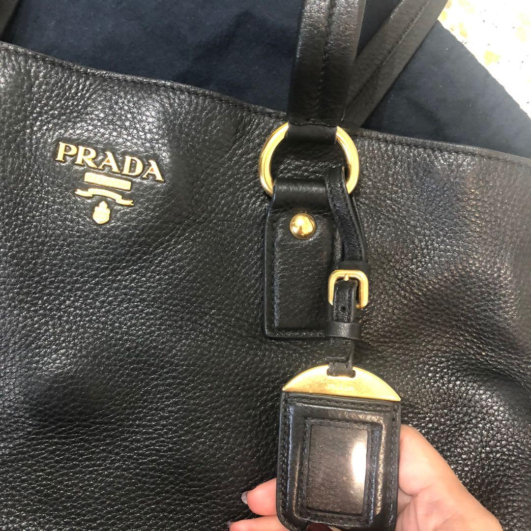 Prada (Category: Tote Bags) located in Singapore. Submitted by rednevalllems (Listing ID 1037063339, Image 3). Description: Prada Leather shoulder bag Excellent condition, No Scuffing, only has a grey stain at base of bag H33cm X L36cm X W12cm .