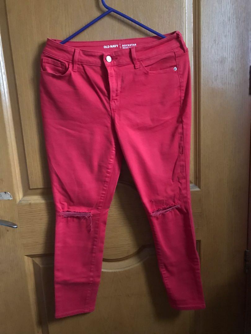 red ripped pants
