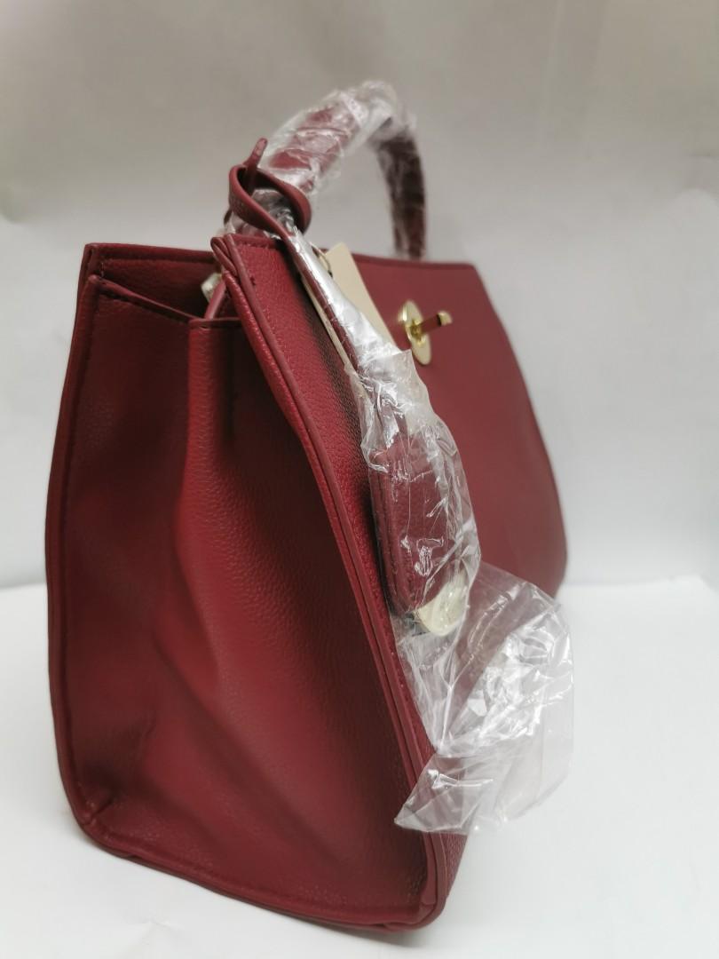 CLN structured bag (maroon red) (Category: Tote Bags) located in Malabon City. Submitted by esg63 (Listing ID 1037996037, Image 3). Description: brand new CLN bag - push lock closure - 2 separate space - 2 type handle ( have extra strap) no any damage - kept an never been use (declutter).