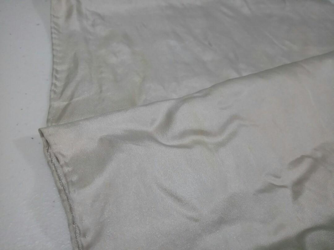 Thin Beige Silk Scarf (Category: Scarves) located in Manila. Submitted by ameri8 (Listing ID 1037941171, Image 3). Description: Size: 11 x 51 inches Material: Silk Flaws: Faint yellow spots in a number of places due to storage (these are hard to capture using my camera but I tried to show them in the 3rd picture) Condition: Good with signs of long storage. This can be used as a hair band or can be tied to your bag..