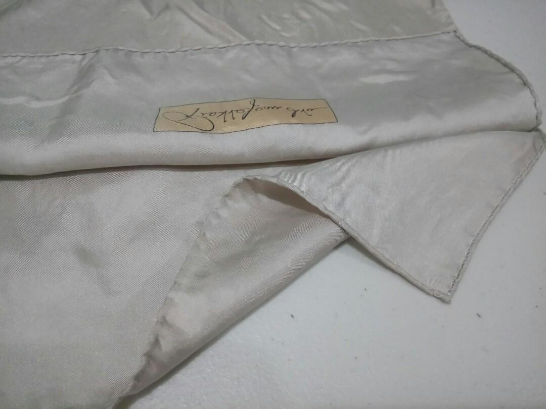 Thin Beige Silk Scarf (Category: Scarves) located in Manila. Submitted by ameri8 (Listing ID 1037941171, Image 2). Description: Size: 11 x 51 inches Material: Silk Flaws: Faint yellow spots in a number of places due to storage (these are hard to capture using my camera but I tried to show them in the 3rd picture) Condition: Good with signs of long storage. This can be used as a hair band or can be tied to your bag..
