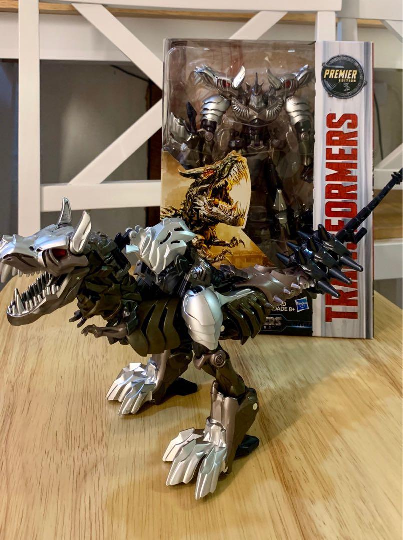 GRIMLOCK ( Transformers MOVIE4 ) voyager (Category: Action & Battle Toys) located in Quezon City. Submitted by transformworld28 (Listing ID 1033570855, Image 2). Description: Authentic HASBRO GRIMLOCK TRANSFORMERS MOVIE 4 Voyager size Almost 10inches tall Collectible Bnew sealed ( sample actual picture attached ) QC free delivery Contact no 09209560528.