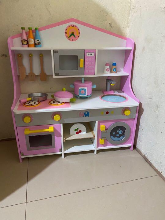 pink wooden toy kitchen