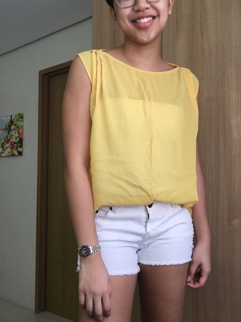 yellow sleeveless top