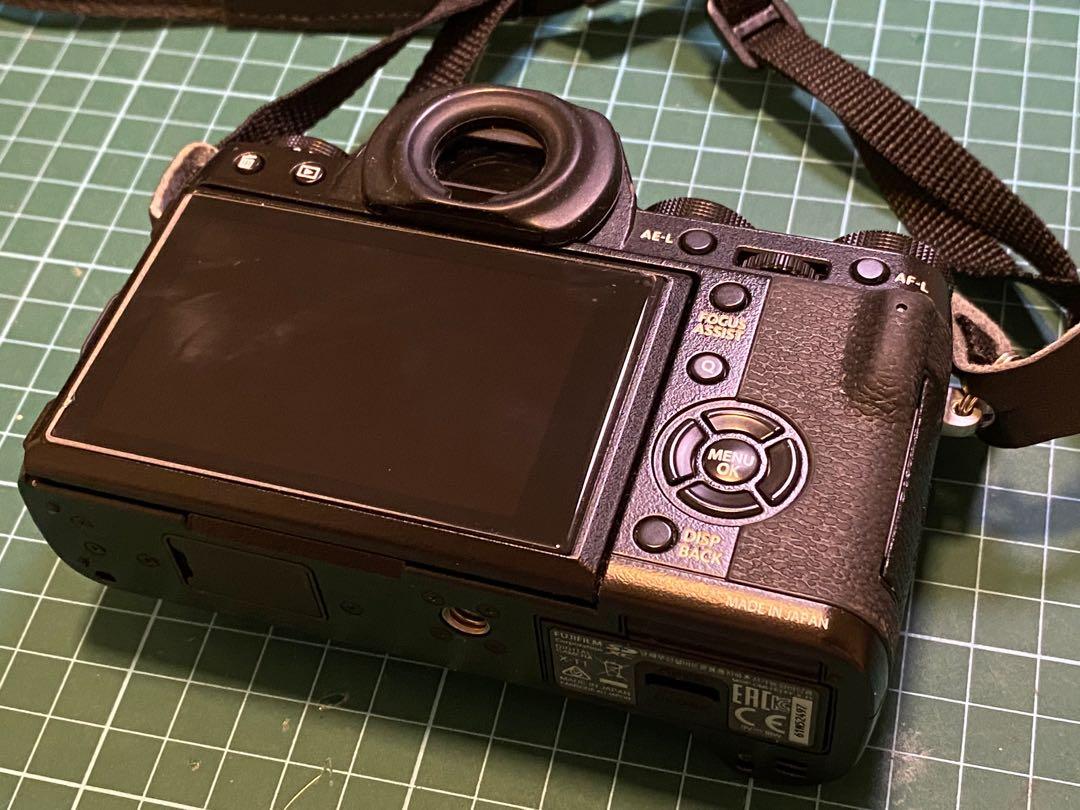 Fuji XT1 body with 4 original batteries, mini flash, leather jacket and