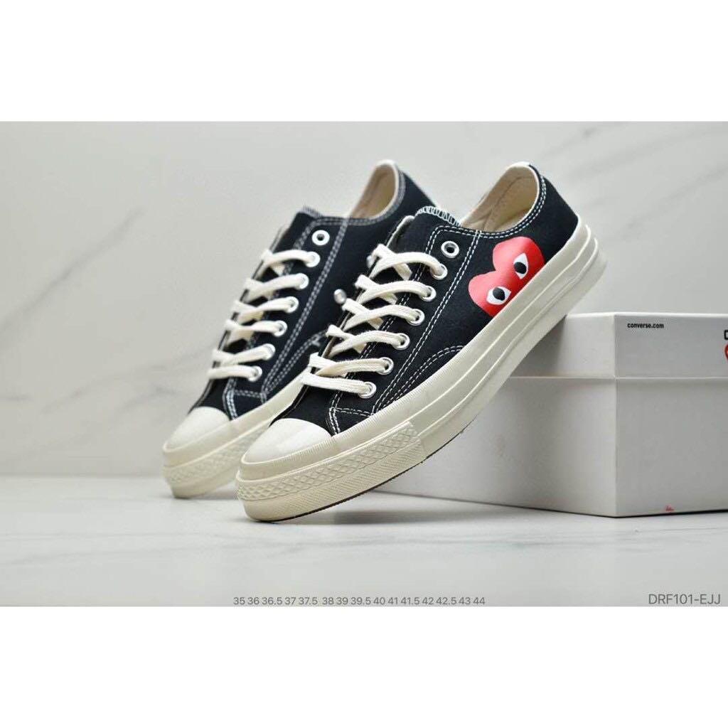 converse with red heart on side