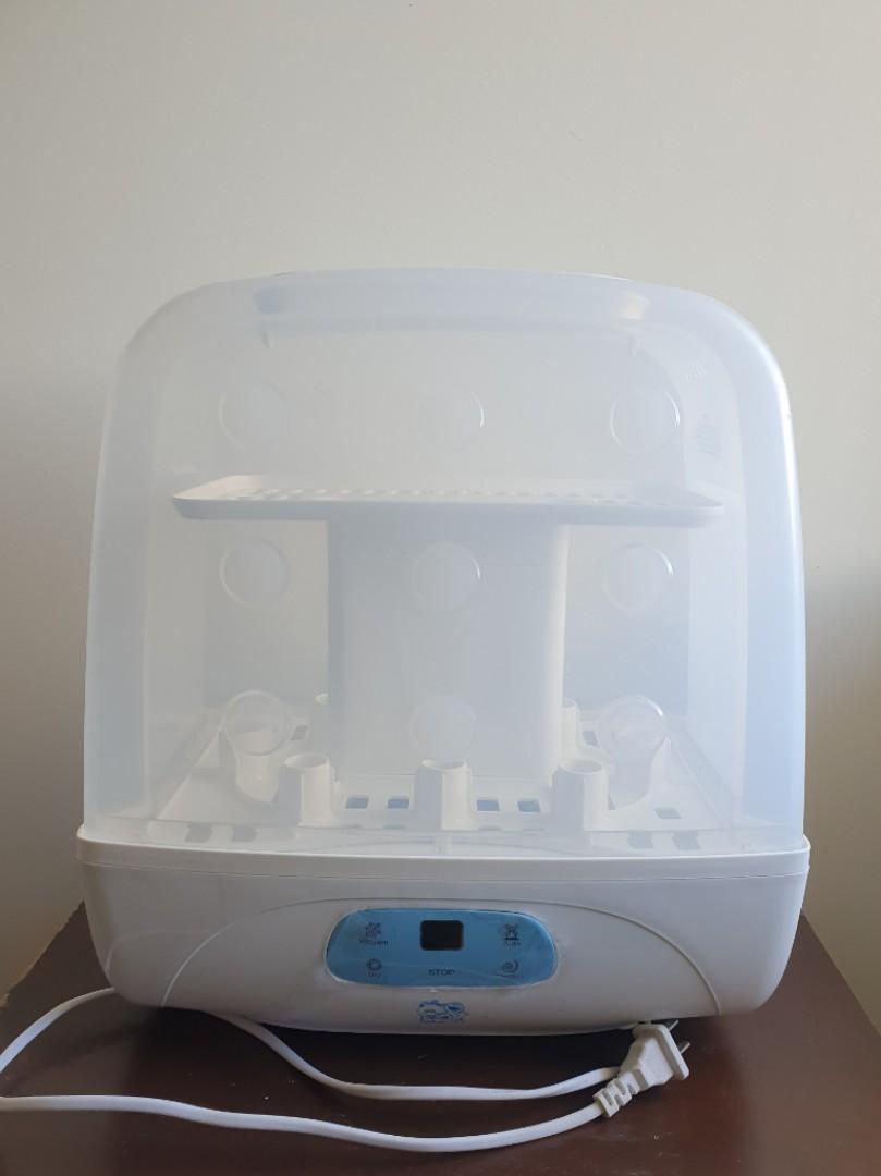 Sesame street sterilizer with dryer outlet