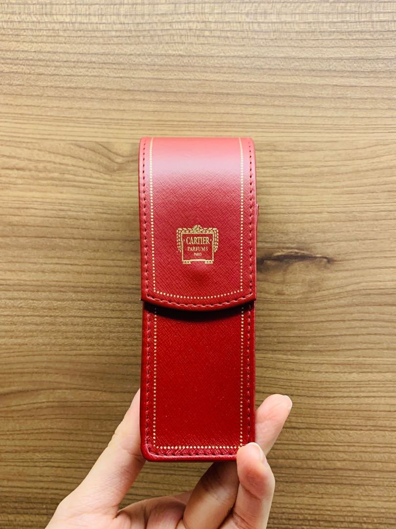 cartier perfume in leather case