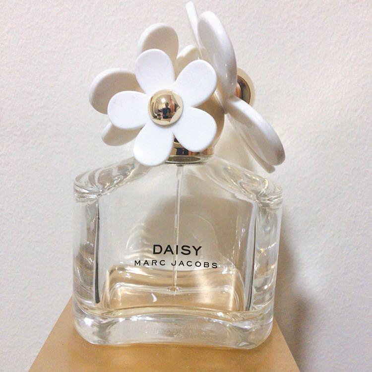 empty daisy perfume bottle