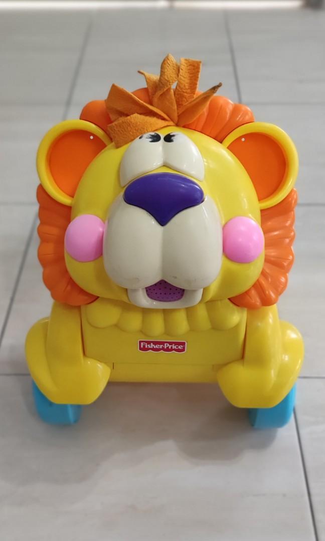 Fisher price lion ride deals on toy