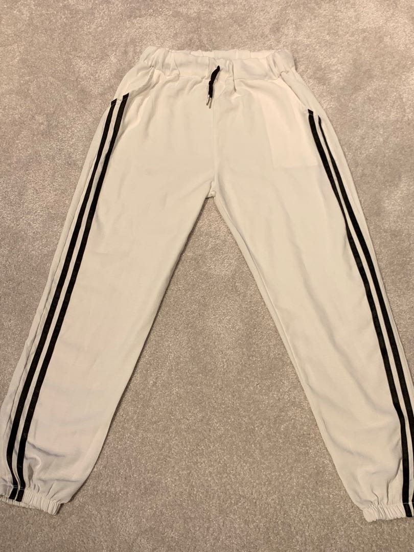 White track pants with black stripe outlet