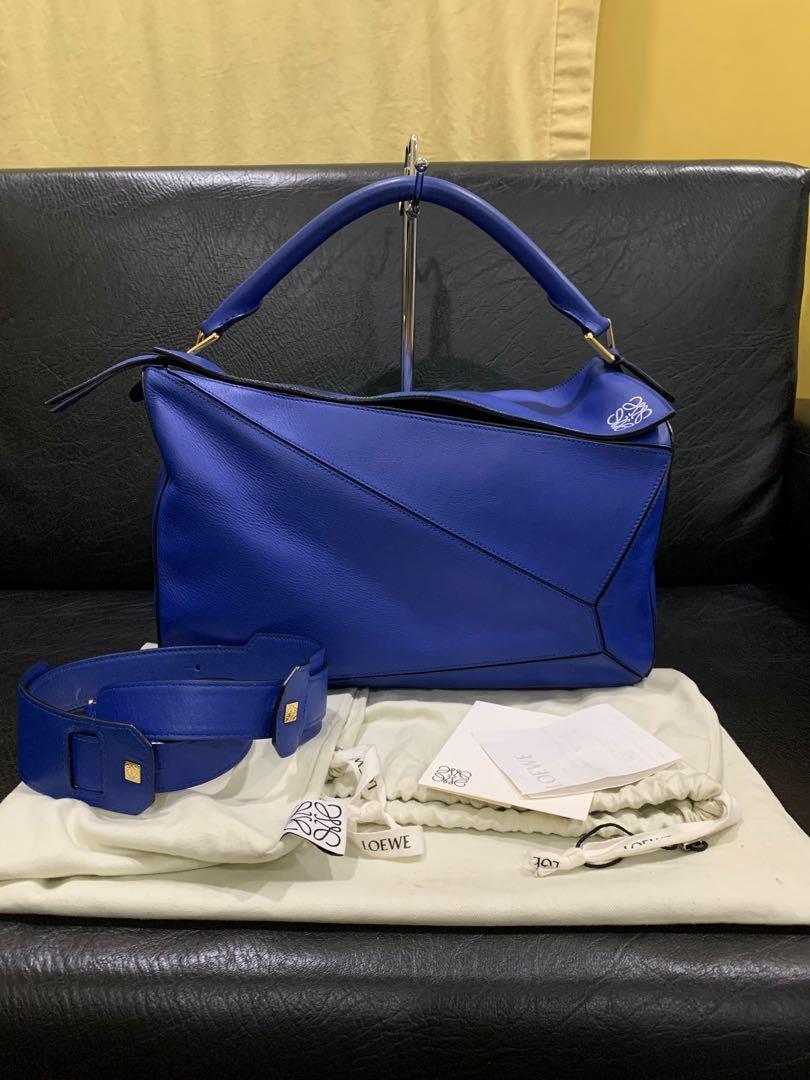 Authentic Loewe Puzzle large bag electric blue (Category: Luxury Bags & Wallets) located in Paranaque City. Submitted by lovebrand (Listing ID 1062105114, Image 1). Description: In excellent condition Comes with dustbag Bought at P180k .