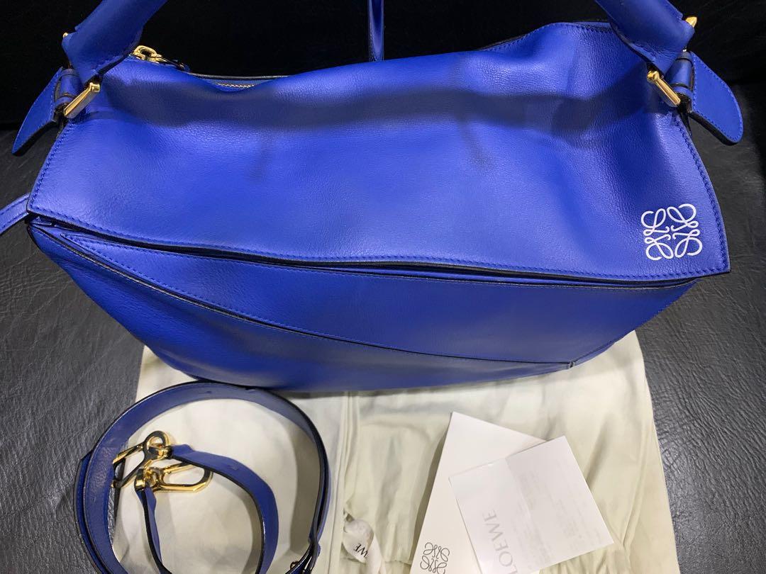 Authentic Loewe Puzzle large bag electric blue (Category: Luxury Bags & Wallets) located in Paranaque City. Submitted by lovebrand (Listing ID 1062105114, Image 3). Description: In excellent condition Comes with dustbag Bought at P180k .