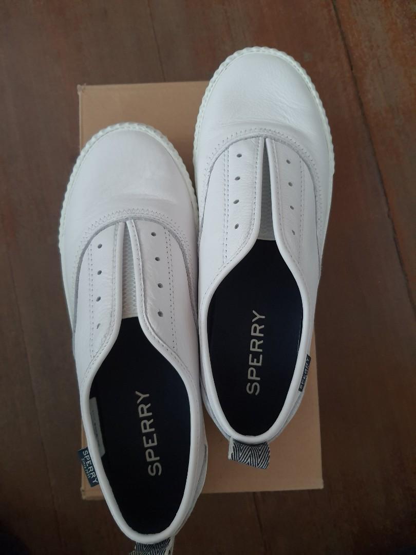 white sperry slip on sneakers