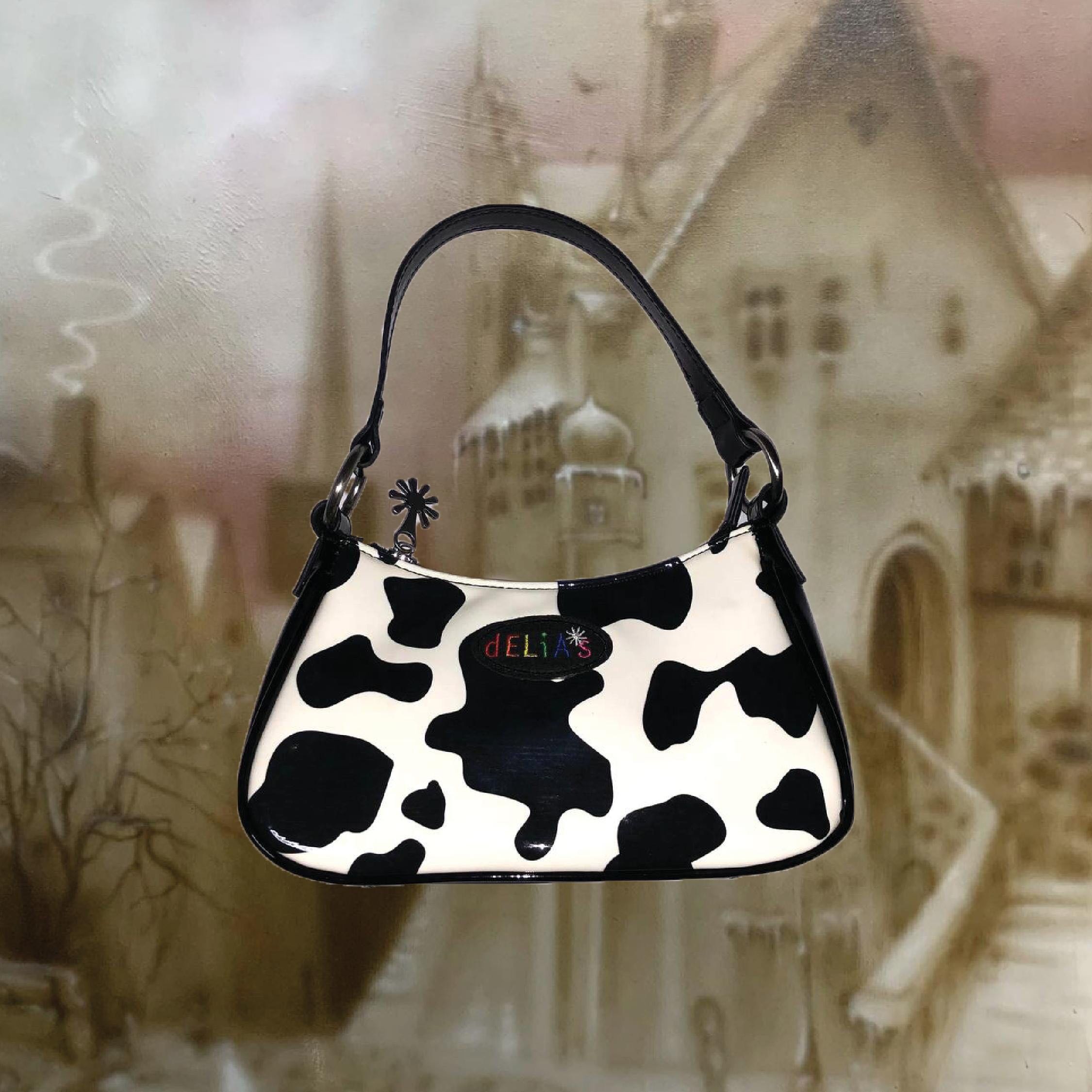 DOLLSKILL DELIAS COW PRINT BAGUETTE BAG Women s