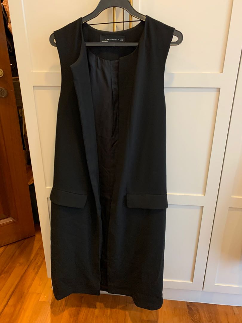 long black sleeveless vest