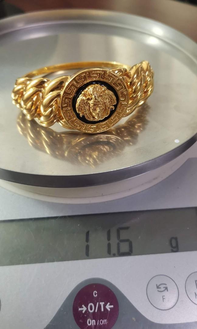 Versace, An 18K gold ring with diamonds ca. 0.12 ct in total. Marked Versace.  - Bukowskis