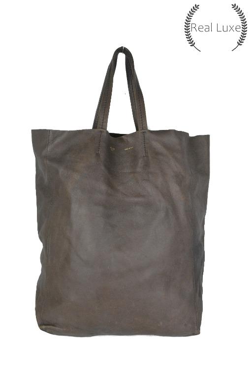 Authentic CELINE cabas leather tote bag (Category: Luxury Bags & Wallets) located in Cagayan de Oro. Submitted by real_luxe (Listing ID 1062965335, Image 1). Description: FLAW: Scuffs, hole No Inclusion ( Encircled ones are the flaws of the item ) The Photos are taken by "US" and water mark on all images to avoid people taking our hard work. We take a lot of photos already with good quality, so hoping you wont ask for more as my time is very limi
