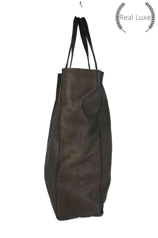 Authentic CELINE cabas leather tote bag (Category: Luxury Bags & Wallets) located in Cagayan de Oro. Submitted by real_luxe (Listing ID 1062965335, Image 3). Description: FLAW: Scuffs, hole No Inclusion ( Encircled ones are the flaws of the item ) The Photos are taken by "US" and water mark on all images to avoid people taking our hard work. We take a lot of photos already with good quality, so hoping you wont ask for more as my time is very limi