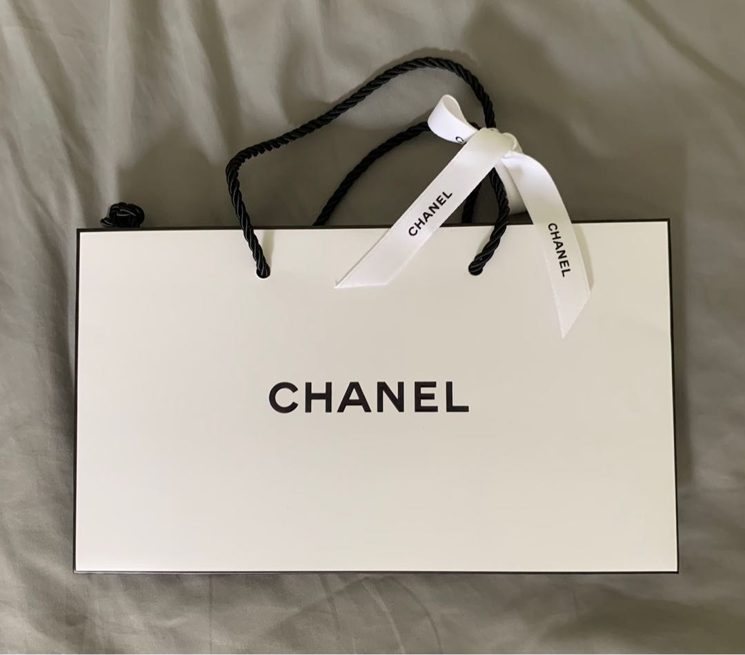 Authentic Chanel paper bag with black or white Chanel ribbon