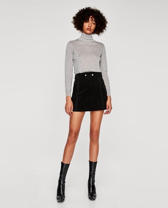 Black suede store skirt with buttons