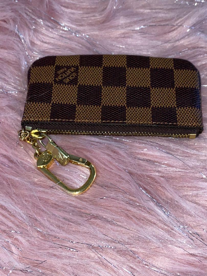 Louis Vuitton Damier Ebene Key Holder Pouch (Category: Luxury Bags & Wallets) located in Marikina City. Submitted by neltan_carousel (Listing ID 1063078182, Image 1). Description: LV Damier Ebene Key Holder Pouch ~ 💯% Authentic/Original ~ Slightly used (no flaws) - 9.5/10 ~ with provided original LV box.