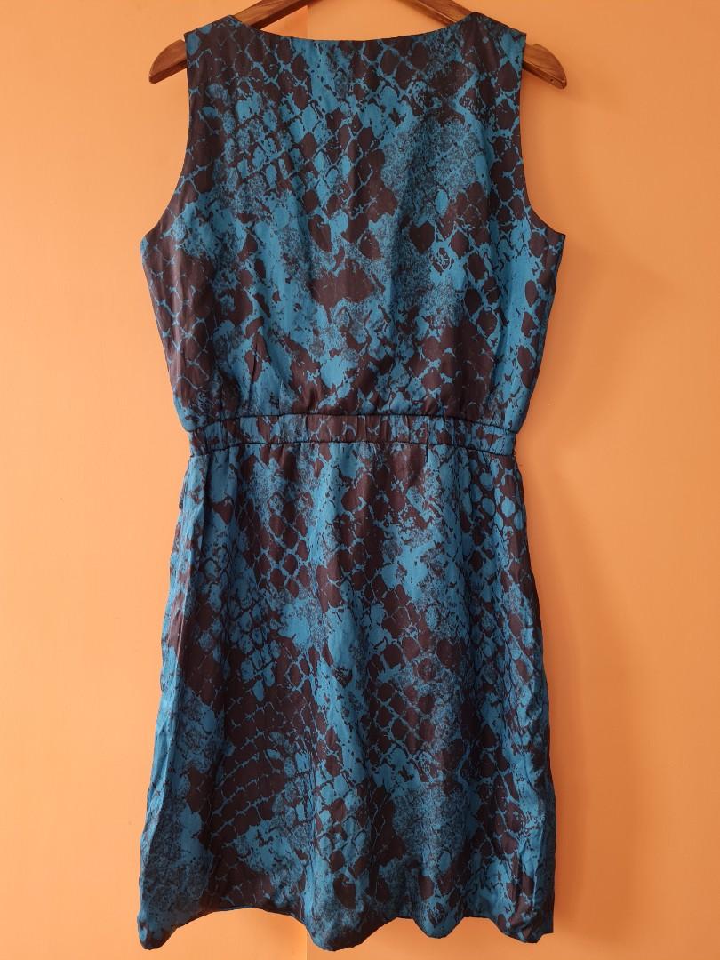 RiTZ sleeveless overlap dress (Category: Dresses) located in Quezon City. Submitted by secondthemotion (Listing ID 1063088060, Image 3). Description: Brand New #RiTZ Eden Sleeveless Dress with garterized waist (Fully Lined) Color: Blue and Black Snake Print Size: Small Material: Matte Satin Status: Brand new, Material Defect run (see pic 7) Size specification: Length (from shoulder)-35" Bust - 35" Garterized waistband relaxed fit-26" (see pics 8 