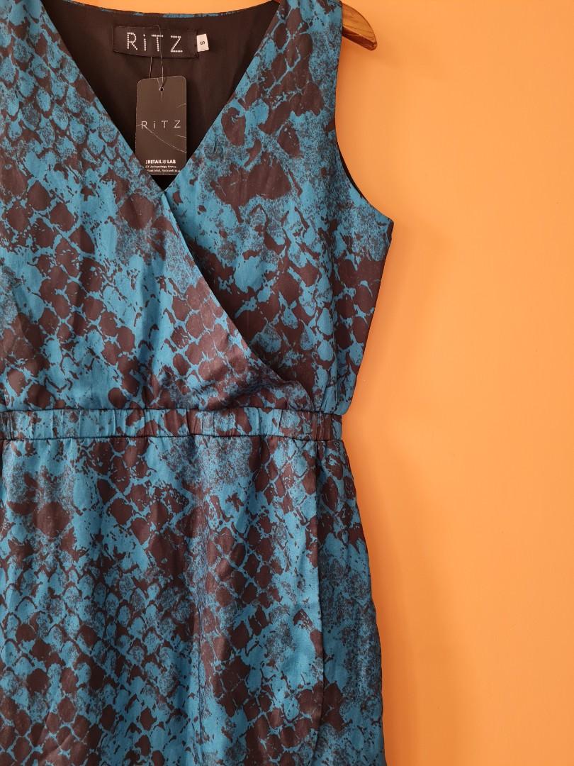 RiTZ sleeveless overlap dress (Category: Dresses) located in Quezon City. Submitted by secondthemotion (Listing ID 1063088060, Image 2). Description: Brand New #RiTZ Eden Sleeveless Dress with garterized waist (Fully Lined) Color: Blue and Black Snake Print Size: Small Material: Matte Satin Status: Brand new, Material Defect run (see pic 7) Size specification: Length (from shoulder)-35" Bust - 35" Garterized waistband relaxed fit-26" (see pics 8 