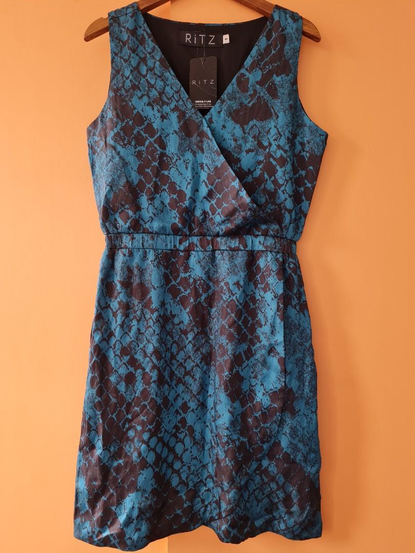 RiTZ sleeveless overlap dress (Category: Dresses) located in Quezon City. Submitted by secondthemotion (Listing ID 1063088060, Image 1). Description: Brand New #RiTZ Eden Sleeveless Dress with garterized waist (Fully Lined) Color: Blue and Black Snake Print Size: Small Material: Matte Satin Status: Brand new, Material Defect run (see pic 7) Size specification: Length (from shoulder)-35" Bust - 35" Garterized waistband relaxed fit-26" (see pics 8 