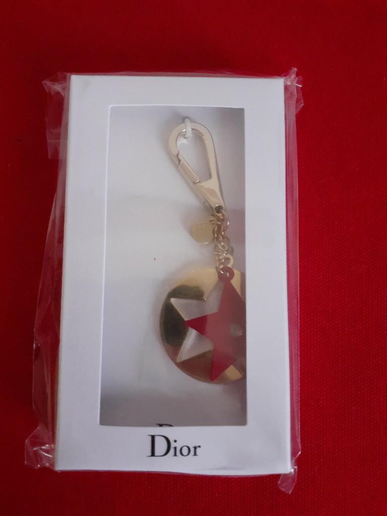 Christian Dior Charm Keychain (Category: Luxury Accessories) located in Paranaque City. Submitted by donjuan_thegreat (Listing ID 1063532754, Image 3). Description: Item is brand new Comes with original box Opened for pictorial purposes Material: Metal Dimensions: Total Length 8.5 cm Diameter 3 cm With 9 cards in different languages For pick-up in UPS 5 Paranaque or can ship at buyers expense .