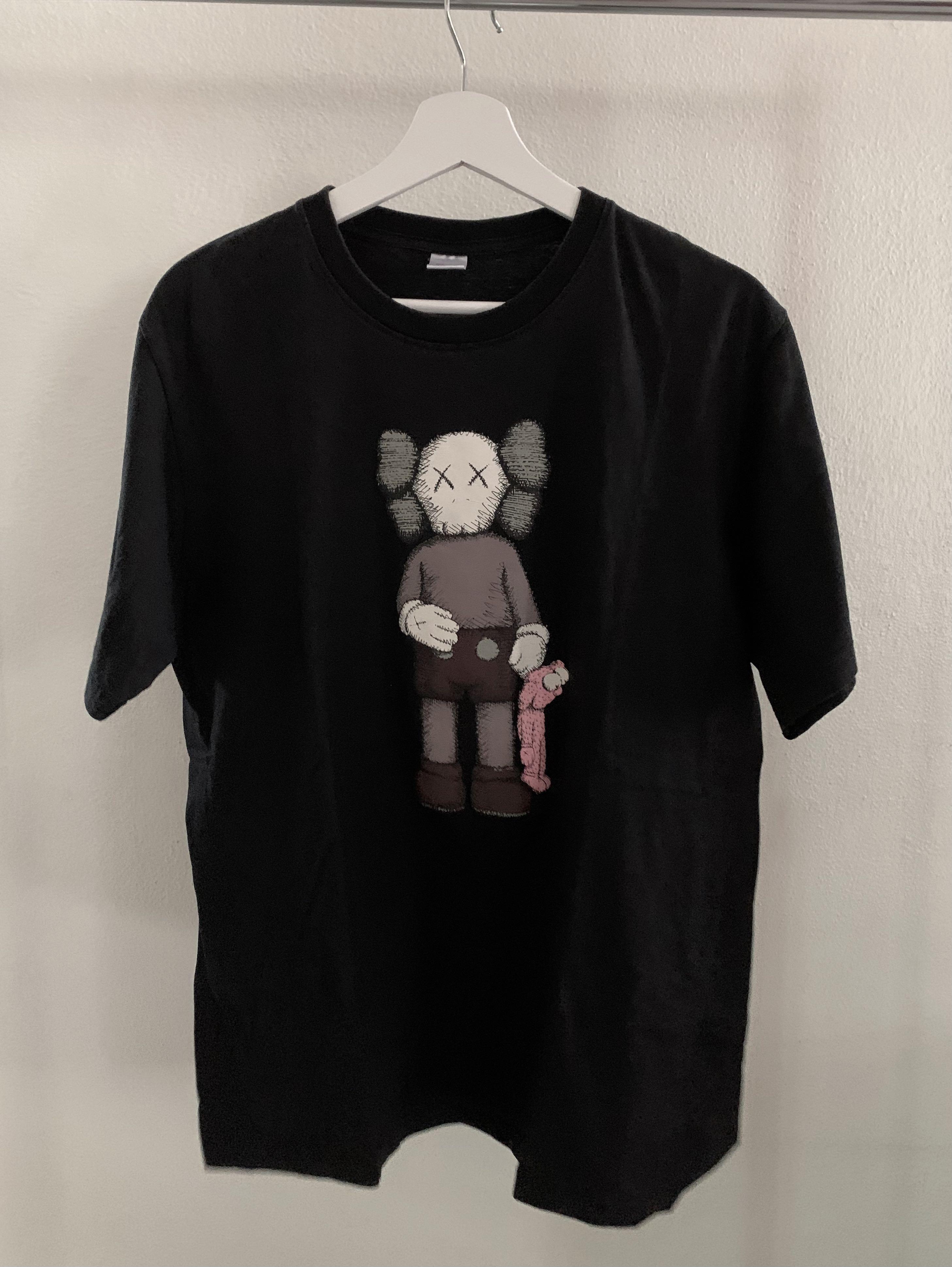 kaws holding shirt