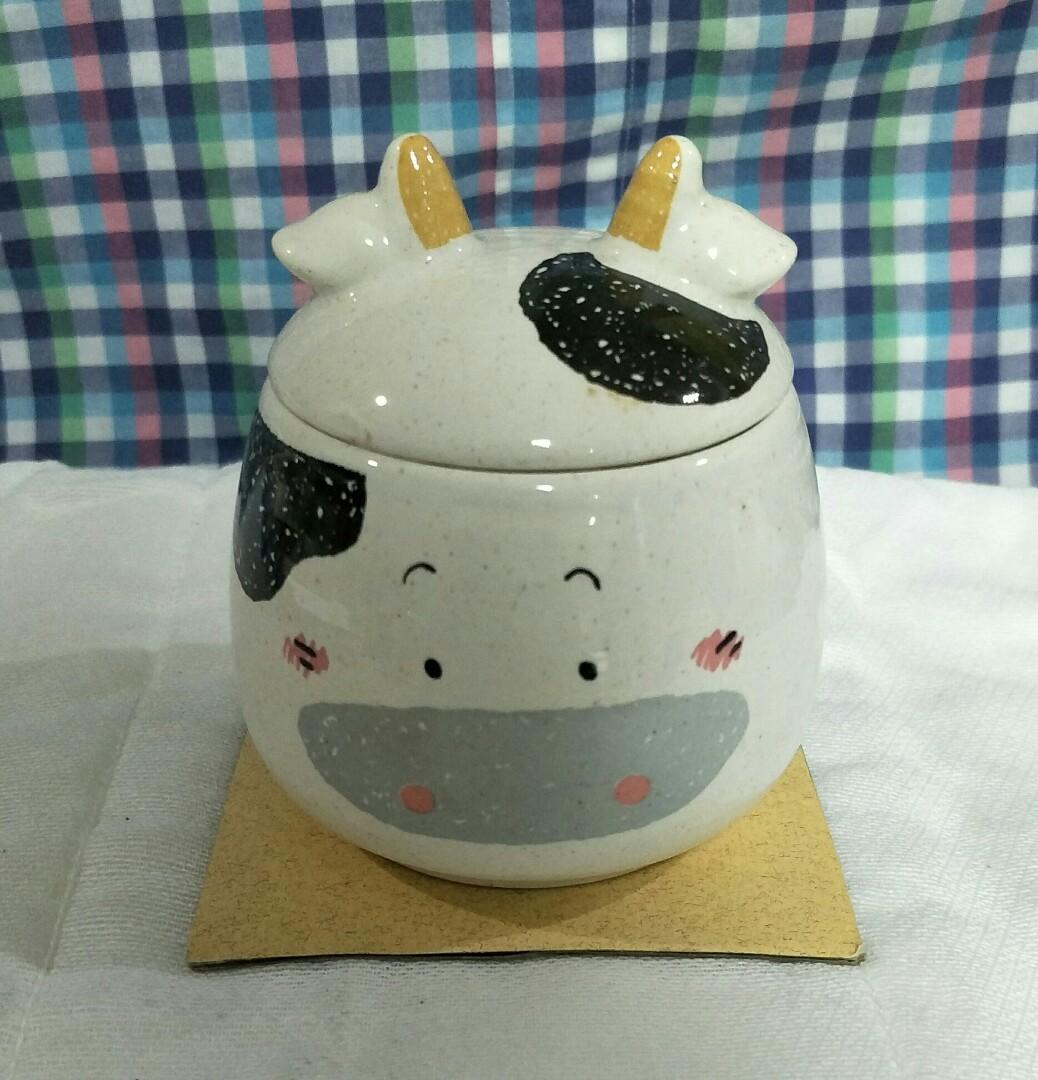 Small Cow Pot with Lid (Category: Food Organization & Storage) located in Paranaque City. Submitted by trinkets_by_joy (Listing ID 1063890445, Image 1). Description: small ceramic jar removable lid "cow" design not airtight for measurements refer to photos can be used in kitchen or for trinkets inquire now!!!.