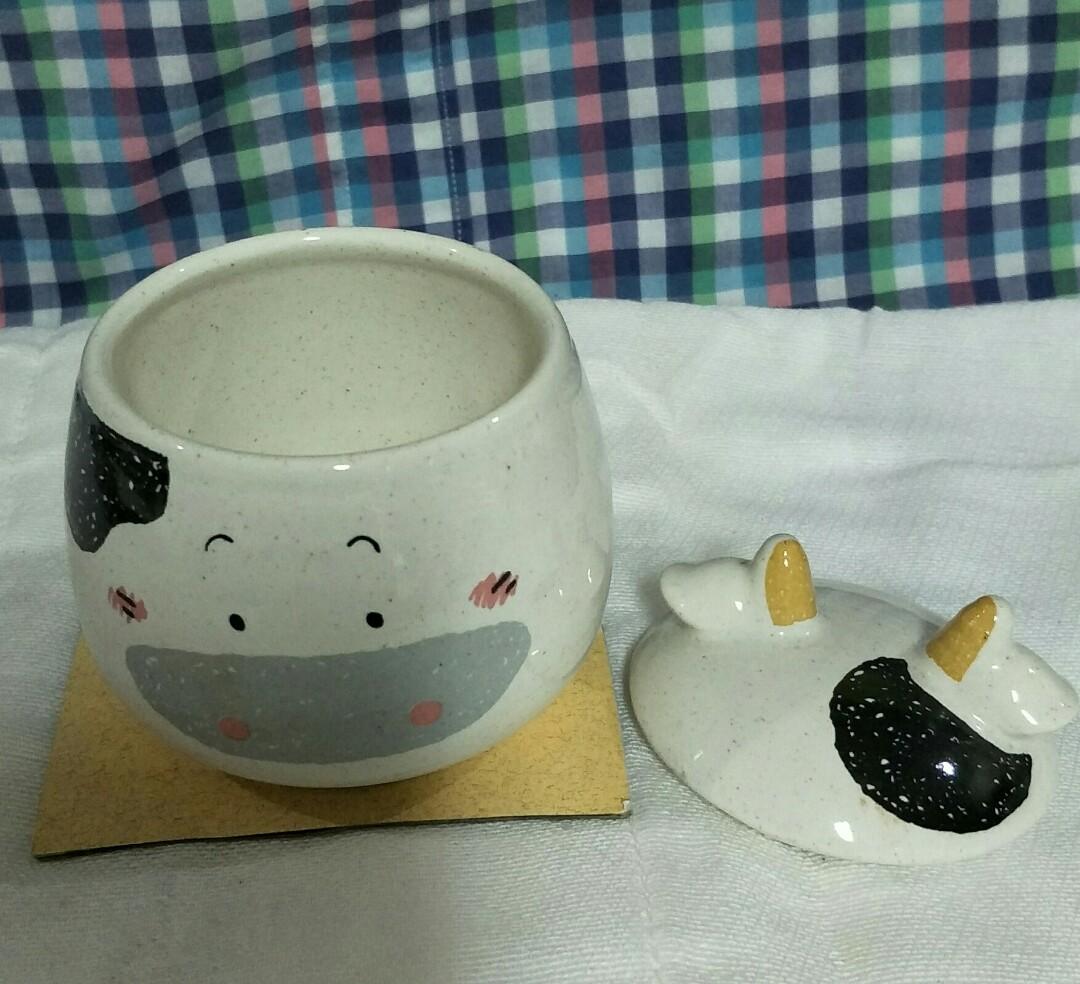 Small Cow Pot with Lid (Category: Food Organization & Storage) located in Paranaque City. Submitted by trinkets_by_joy (Listing ID 1063890445, Image 2). Description: small ceramic jar removable lid "cow" design not airtight for measurements refer to photos can be used in kitchen or for trinkets inquire now!!!.