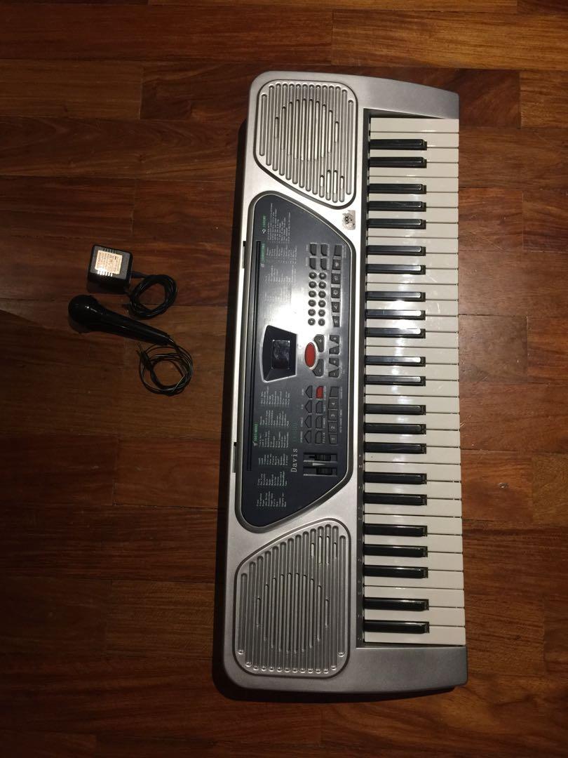 Electric Piano/Organ (DAVIS D-669) (Category: Musical Instruments) located in Cainta. Submitted by giyanseyo (Listing ID 1064170904, Image 1). Description: Davis D-669 54 keys Electric Piano/Organ with mic and charging adaptor Price: 2,750 (NEGOTIABLE) Issue: crack middle (please see images), no issue playing the piano, all keys are working fine.