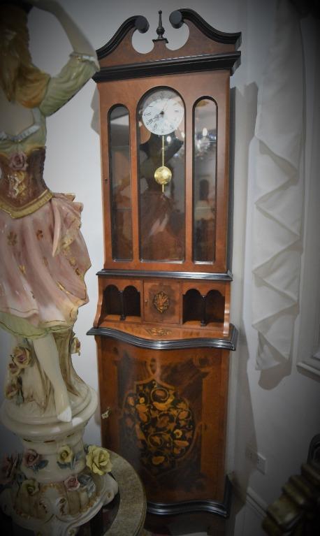 Grandfather's Clock (Category: Clocks) located in Mandaluyong City. Submitted by cherishla (Listing ID 1064156719, Image 1). Description: Long case or better known as Grandfather’s clock. Lower part has 4 pigeon holes and a cabinet with a golden special key. Battery-operated. H 83 x W 24inches .