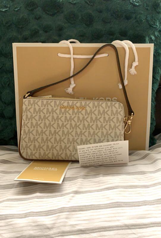 Michael kors large wristlet-vanilla, Women's Fashion, Bags & Wallets,  Clutches on Carousell